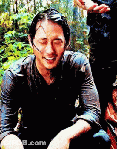 Man In Wet Shirt Smiling Looking Down GIF
