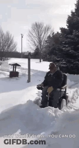 Man In Wheelchair Driving Snowy Driveway GIF