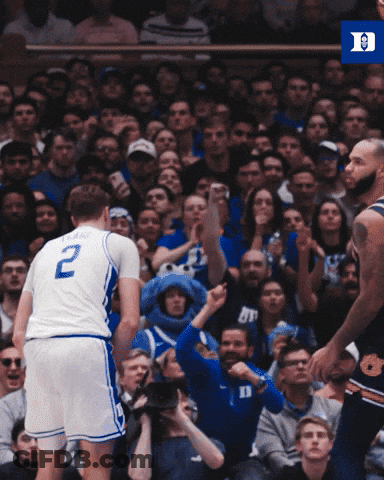 Man In Wheelchair Playing Video Game In Front Of ACC Banner GIF