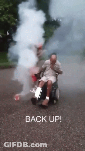 Man In Wheelchair With Cast Smoking GIF