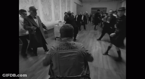 Man In Wheelchair With Condamna Psychopathe Jacket GIF