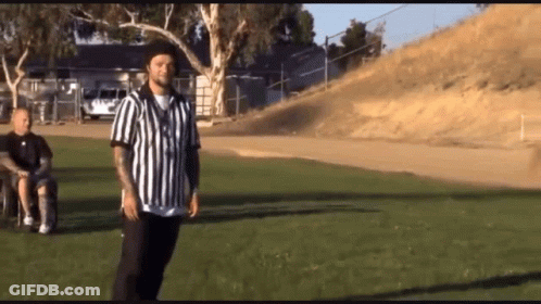 Man In Wheelchair With Referee In Striped Shirt GIF