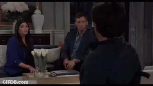 Man In Wheelchair With Two People In Living Room GIF