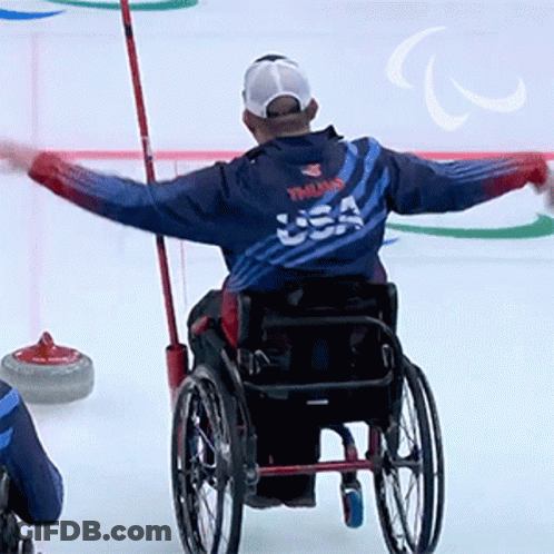 Man In Wheelchair With USA Jacket GIF