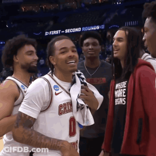 Man In Where More Begins Shirt Talking To Basketball Player GIF