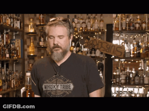 Man In Whisky Tribe Shirt At Bar GIF