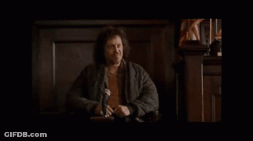Man In White Adidas Next To Man In Black Jacket GIF