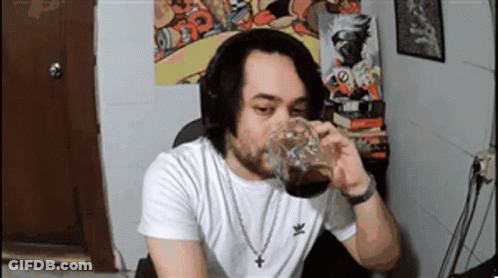 Man In White Adidas Shirt Drinking From Cup GIF