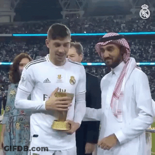 Man In White Adidas Shirt Holding Trophy GIF