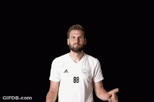 Man In White Adidas Shirt Points Up GIF