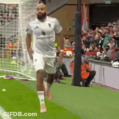Man In White Adidas Shirt Running On Field GIF