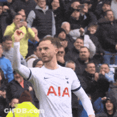 Man In White AIA Jersey In Front Of Crowd GIF