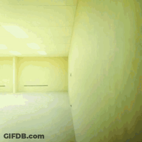 Man In White And Black Running Through Furniture GIF