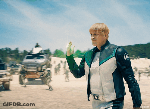 Man In White And Green Jacket With Letter O GIF