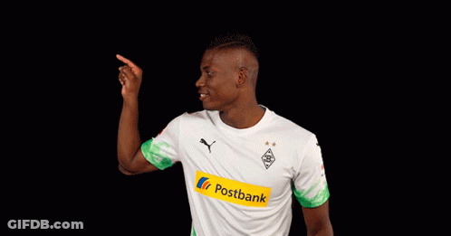 Man In White And Green Postbank Jersey Pointing Up GIF