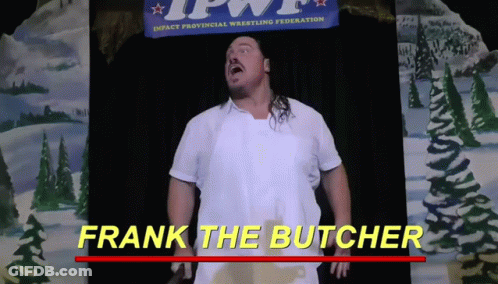 Man In White Apron Standing In Front Of Frank The Butcher Banner GIF