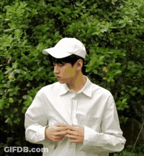 Man In White Baseball Cap And White Striped Shirt GIF