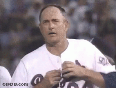 Man In White Baseball Uniform Holding Pen GIF