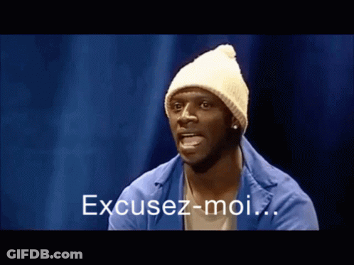 Man In White Beanie And Blue Jacket Says Excusez-Moi GIF