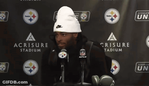 Man In White Beanie In Front Of Steelers Nation Unite Sign GIF