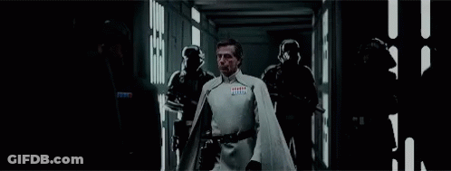 Man In White Cape Walking With Group GIF