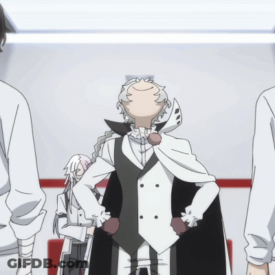 Man In White Coat And Black Vest Standing In Room GIF