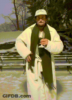 Man In White Coat And Scarf Holding Wine GIF