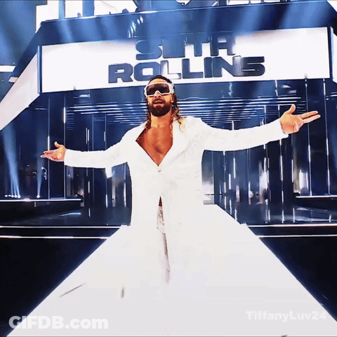 Man In White Coat And Sunglasses At Seth Rolling Sign GIF