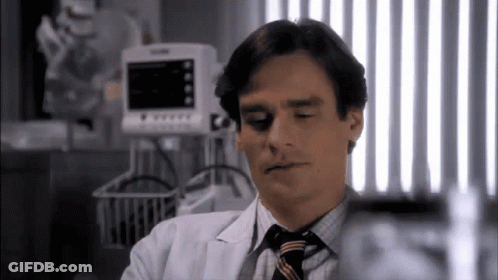 Man In White Coat And Tie At Monitor GIF