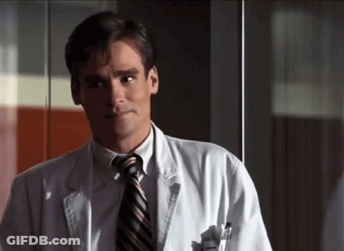 Man In White Coat And Tie Looking Left GIF
