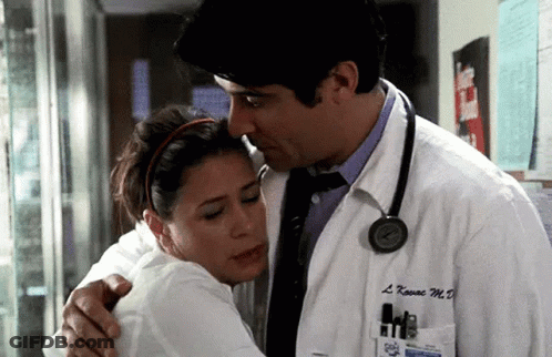 Man In White Coat Hugging Woman With Stethoscope GIF