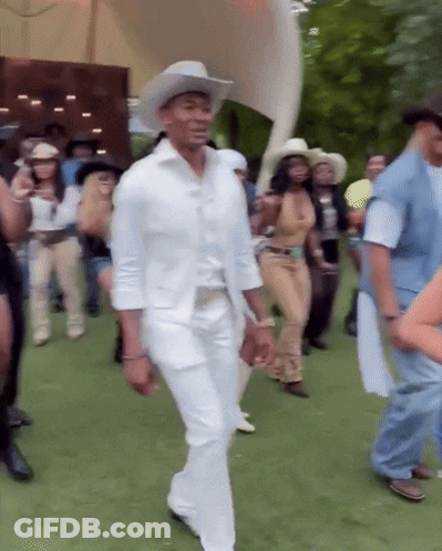 Man In White Cowboy Hat Dancing In Crowd GIF