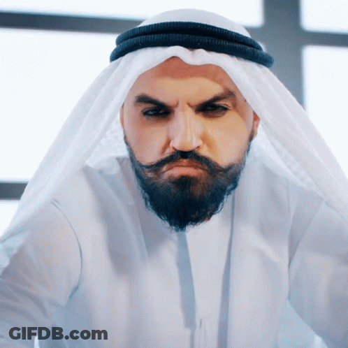 Man In White Dress And Hat With Suri Tuna Sign GIF