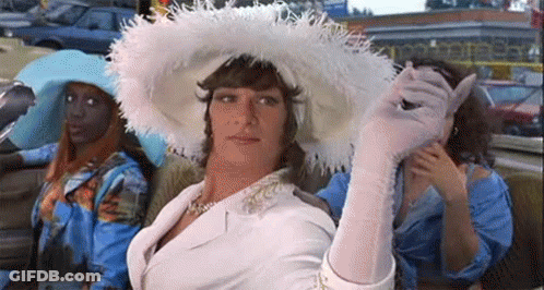 Man In White Hat And Gloves Sitting In Car With Women GIF