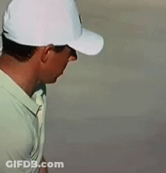 Man In White Hat And Green Shirt Looking Down GIF