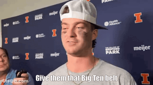 Man In White Hat And Grey Shirt Says Give Them That Big Ten Belt GIF