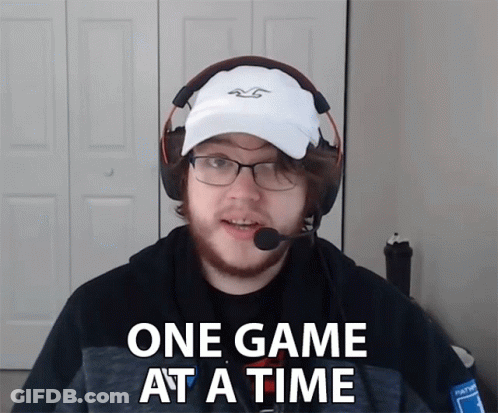 Man In White Hat And Headphones Says One Game At A Time GIF
