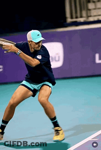 Man In White Hat And New Balance Shirt Looking At Another Man GIF
