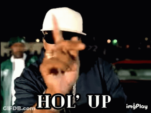 Man In White Hat Flipping Off Hol Up GIF