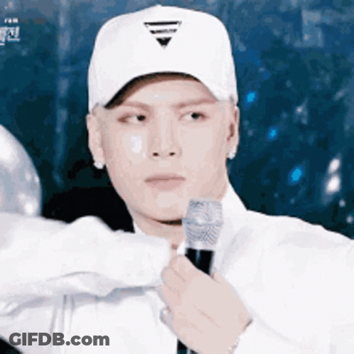 Man In White Hat Holding Microphone GIF