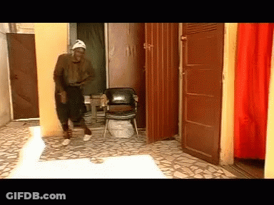 Man In White Hat In Hallway GIF