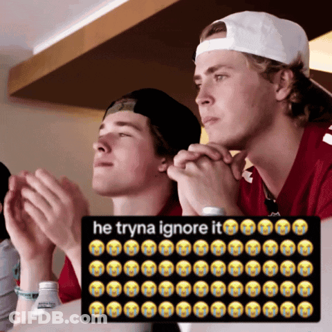 Man In White Hat Sitting Next To Man In Red Shirt Praying GIF