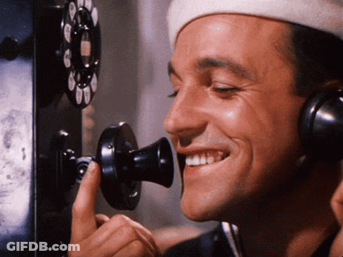 Man In White Hat Smiling On Phone GIF