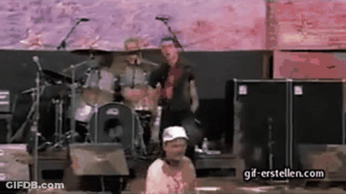 Man In White Hat Standing Before Drum Set GIF
