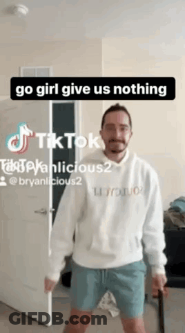 Man In White Hoodie And Blue Shorts Holding Cane GIF