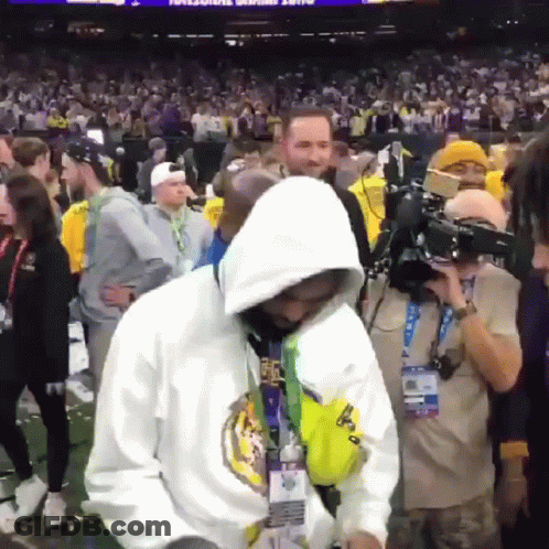 Man In White Hoodie Before Crowd GIF