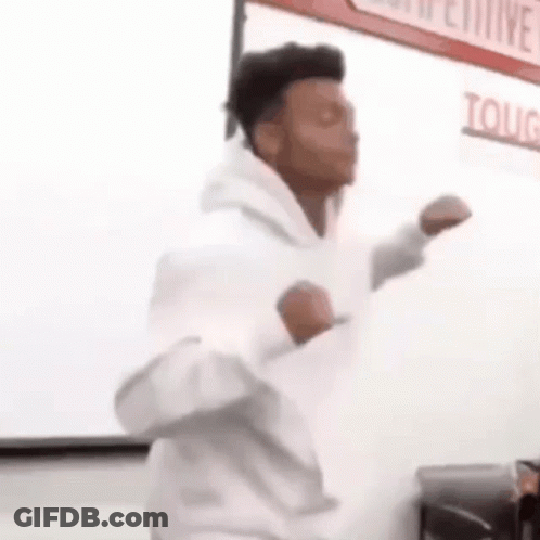 Man In White Hoodie Dancing In Classroom GIF