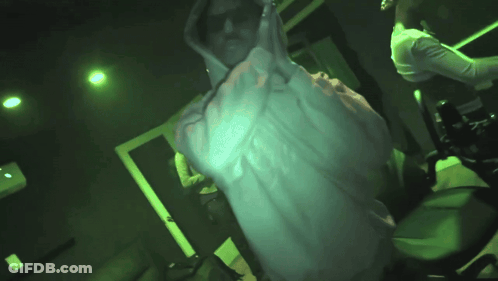 Man In White Hoodie In Dark Room GIF