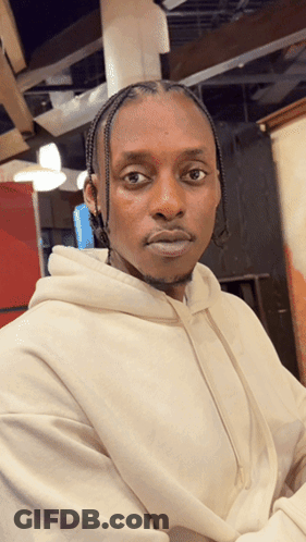 Man In White Hoodie Looks Serious GIF