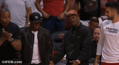 Man In White Hot Playoffs Shirt In Stands GIF